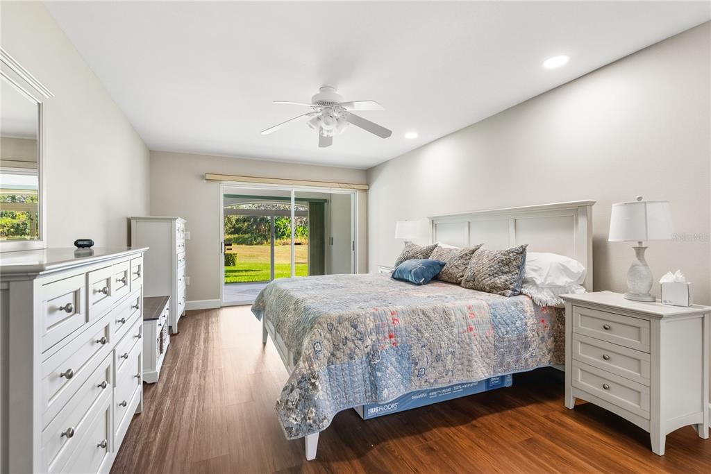 4016 Oakley Greene, Unit 40 Sarasota, FL 34235 - Photo 20 of 51 a bedroom with a bed and a dresser