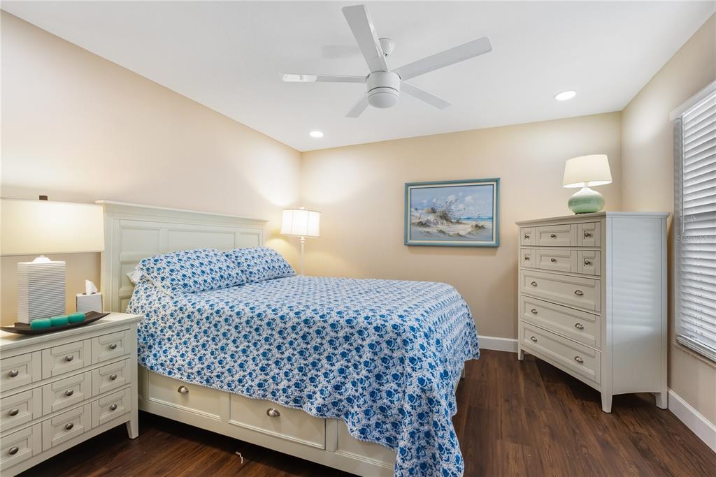 4016 Oakley Greene, Unit 40 Sarasota, FL 34235 - Photo 23 of 51 a bedroom with a bed and a dresser