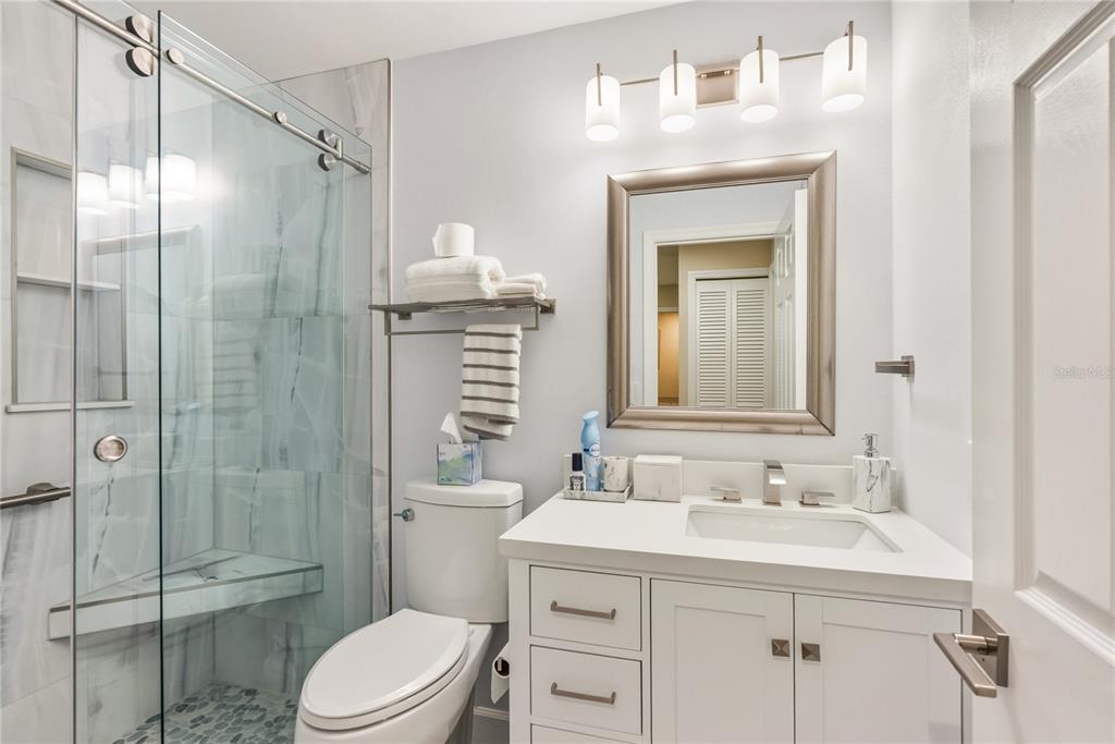 4016 Oakley Greene, Unit 40 Sarasota, FL 34235 - Photo 25 of 51 a bathroom with a sink a toilet and shower
