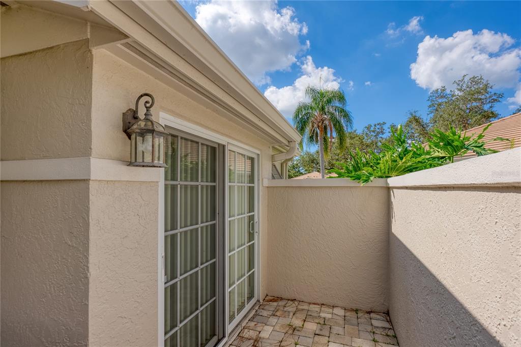 4016 Oakley Greene, Unit 40 Sarasota, FL 34235 - Photo 29 of 51 a potted plant sitting in front of a door