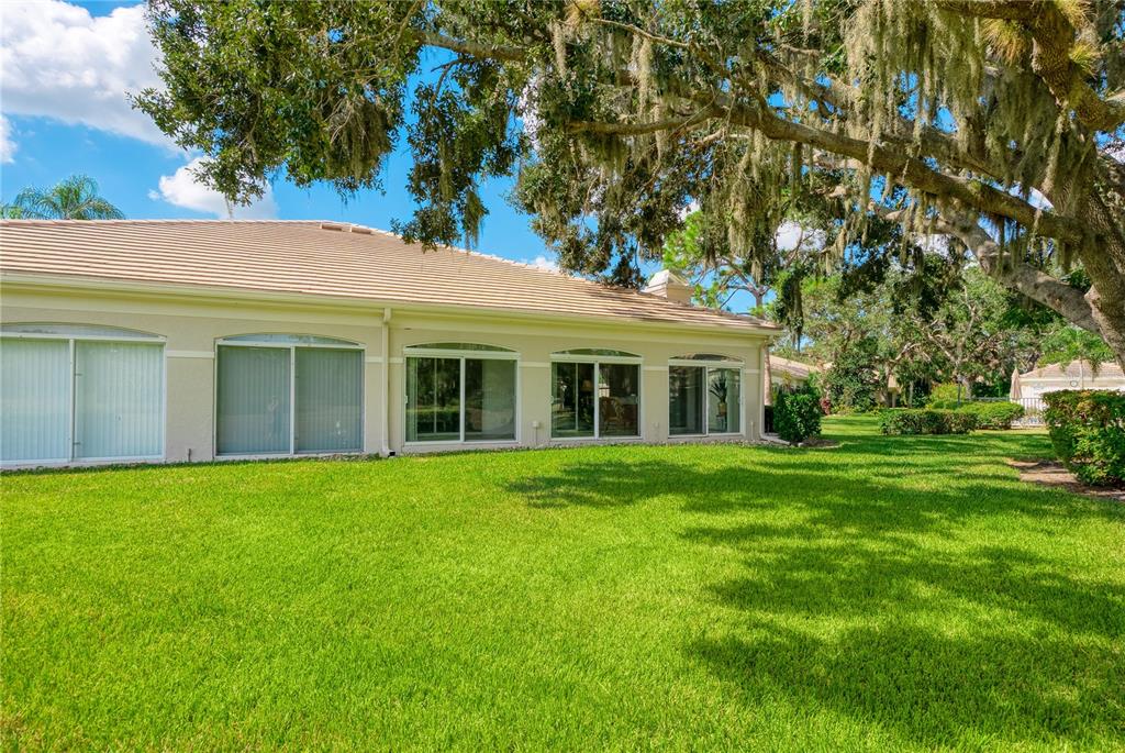 4016 Oakley Greene, Unit 40 Sarasota, FL 34235 - Photo 33 of 51 a view of a house with a garden