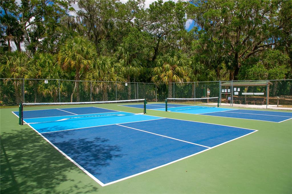 4016 Oakley Greene, Unit 40 Sarasota, FL 34235 - Photo 48 of 51 a view of a tennis court