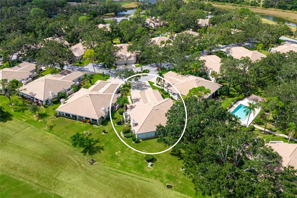 4016 Oakley Greene, Unit 40 Sarasota, FL 34235 - Photo 5 of 51 an aerial view of a swimming pool