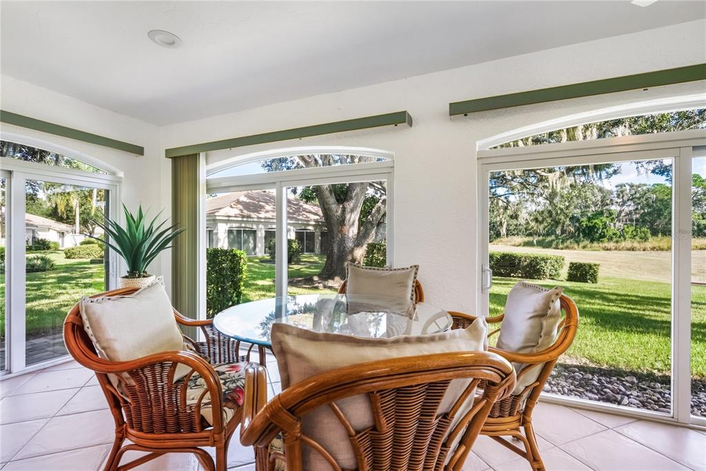 4016 Oakley Greene, Unit 40 Sarasota, FL 34235 - Photo 10 of 51 a view of a dining room with furniture window and outside view