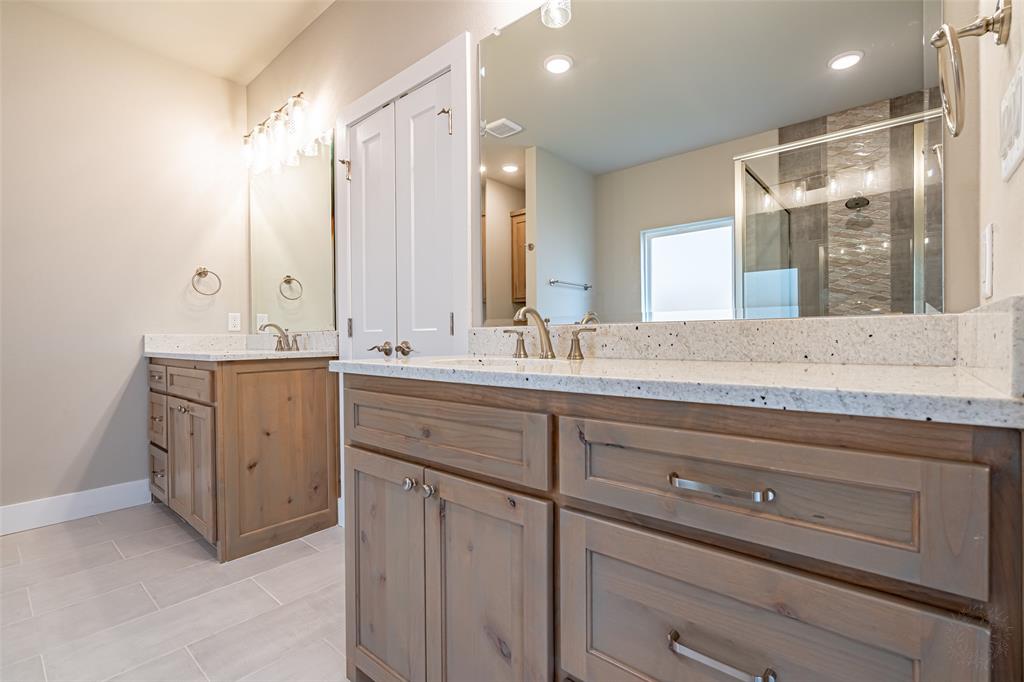 2044 Salina Circle Granbury, TX 76048 - Photo 17 of 38 a bathroom with a granite countertop sink mirror and double