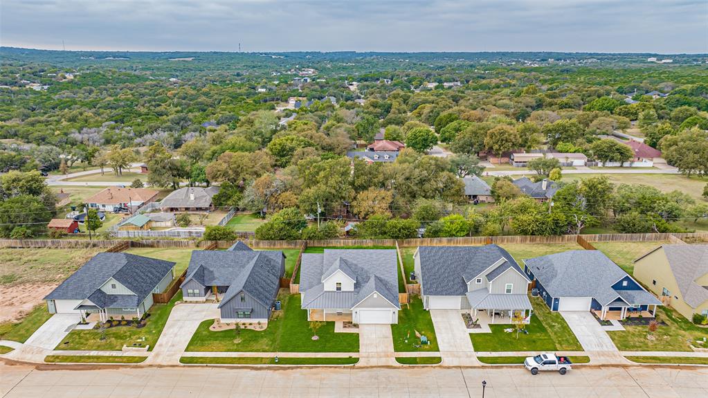 2044 Salina Circle Granbury, TX 76048 - Photo 38 of 38 an aerial view of residential houses with outdoor space and parking