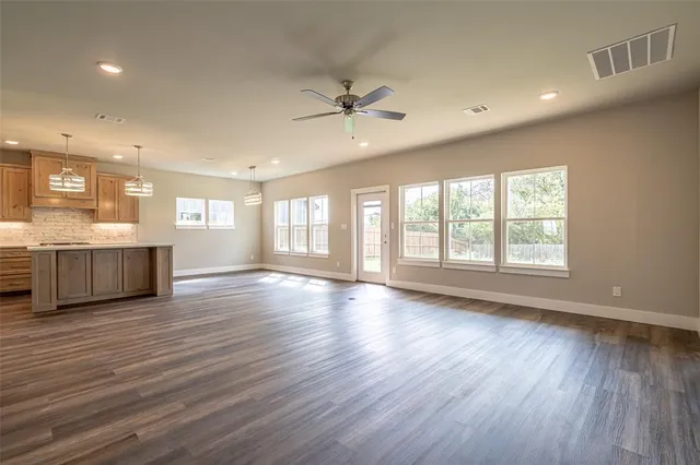 a stove top oven sitting inside of a kitchen