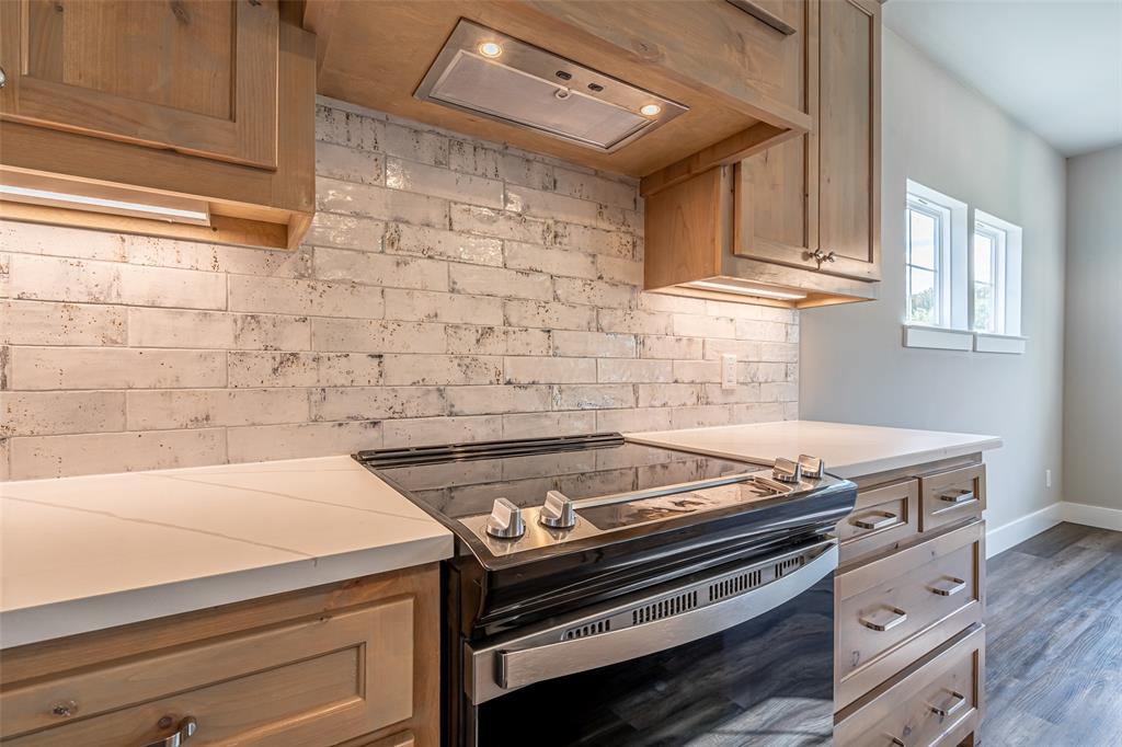 2044 Salina Circle Granbury, TX 76048 - Photo 6 of 38 a stove top oven sitting inside of a kitchen