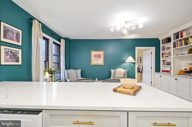 a bedroom with a large bed and a dresser