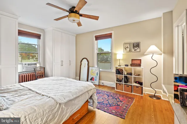 a bed room with a bed and a chandelier