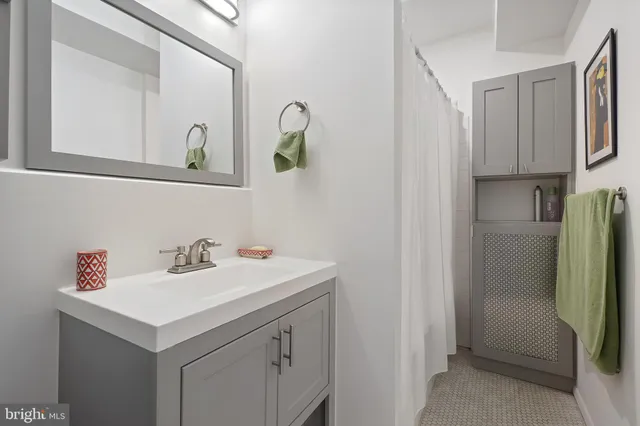 a bathroom with a sink and a mirror