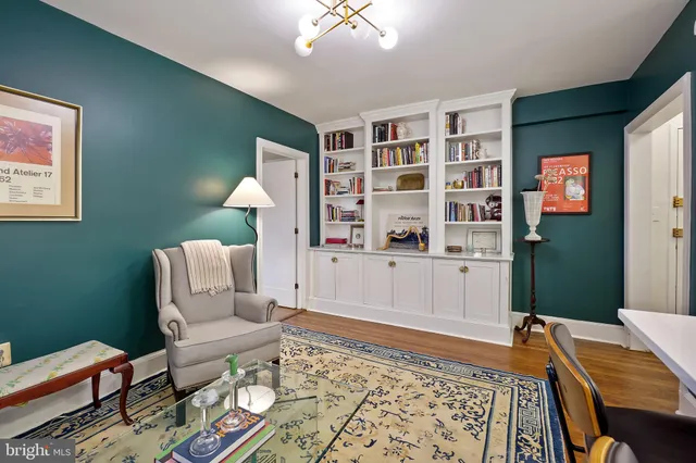 a living room with furniture and a rug