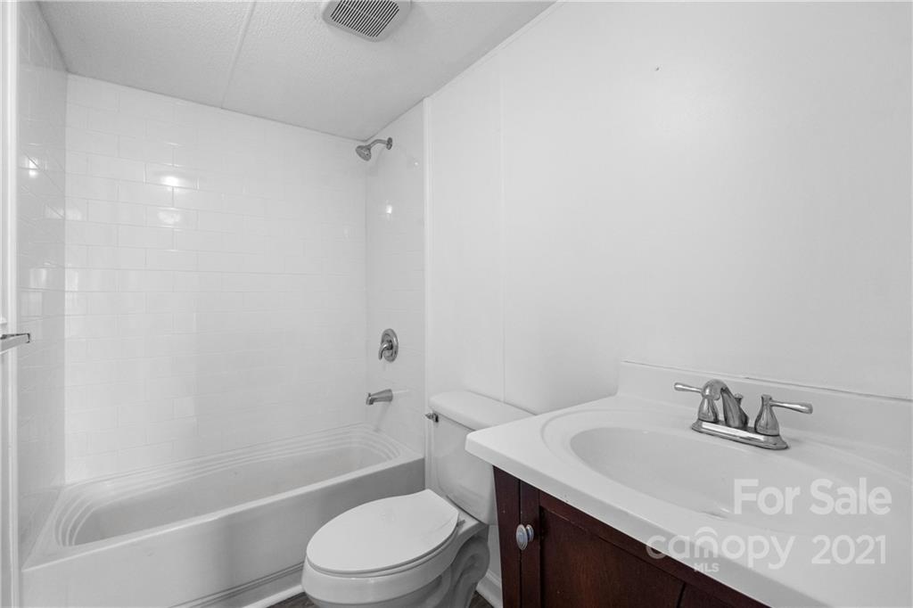 175 Reading Road Salisbury, NC 28147 - Photo 23 of 38 a bathroom with a sink toilet vanity and shower