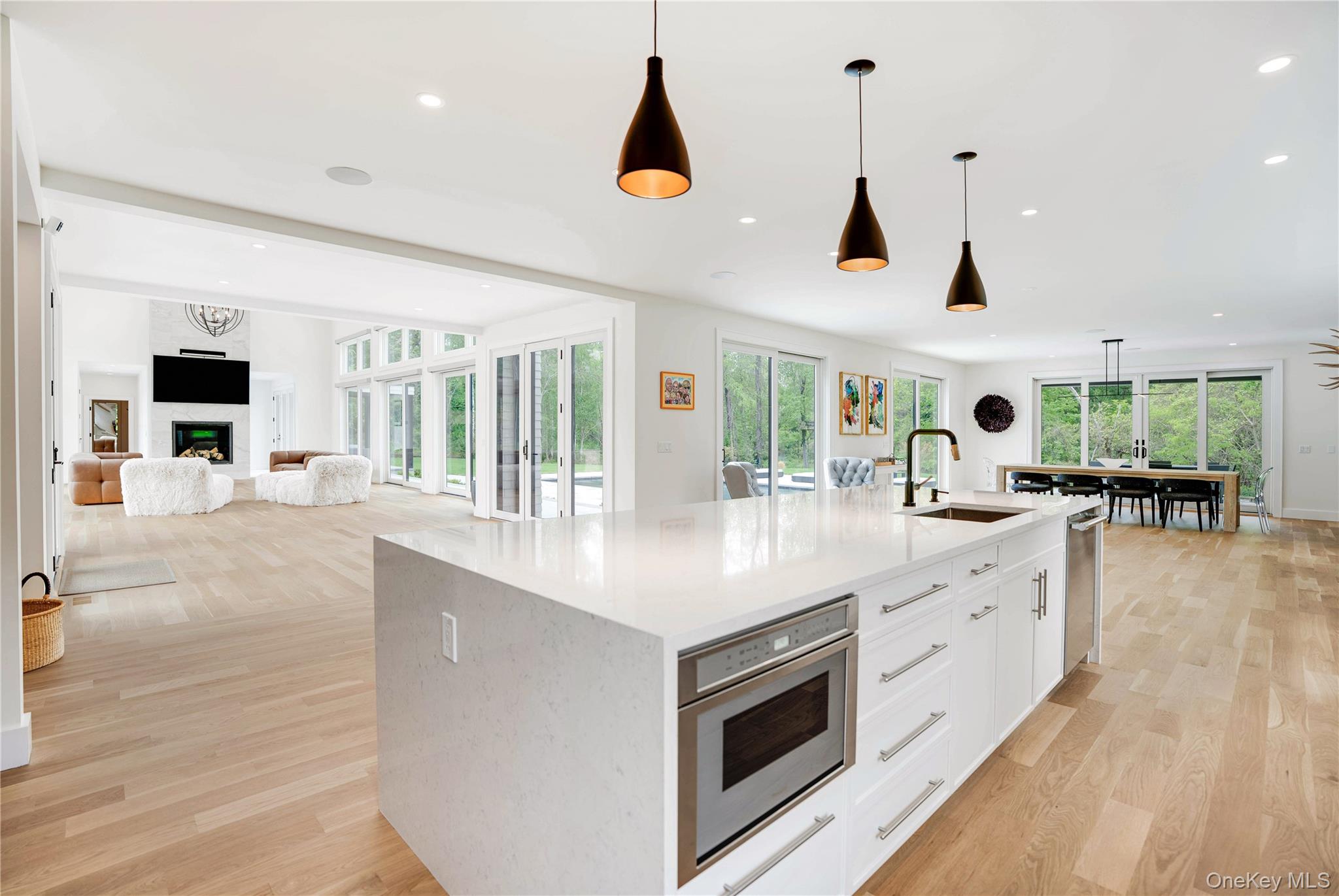 100 South Ferry Road Shelter Island, NY 11964 - Photo 13 of 28 a large kitchen with stainless steel appliances kitchen island a large counter tops and a view of living room
