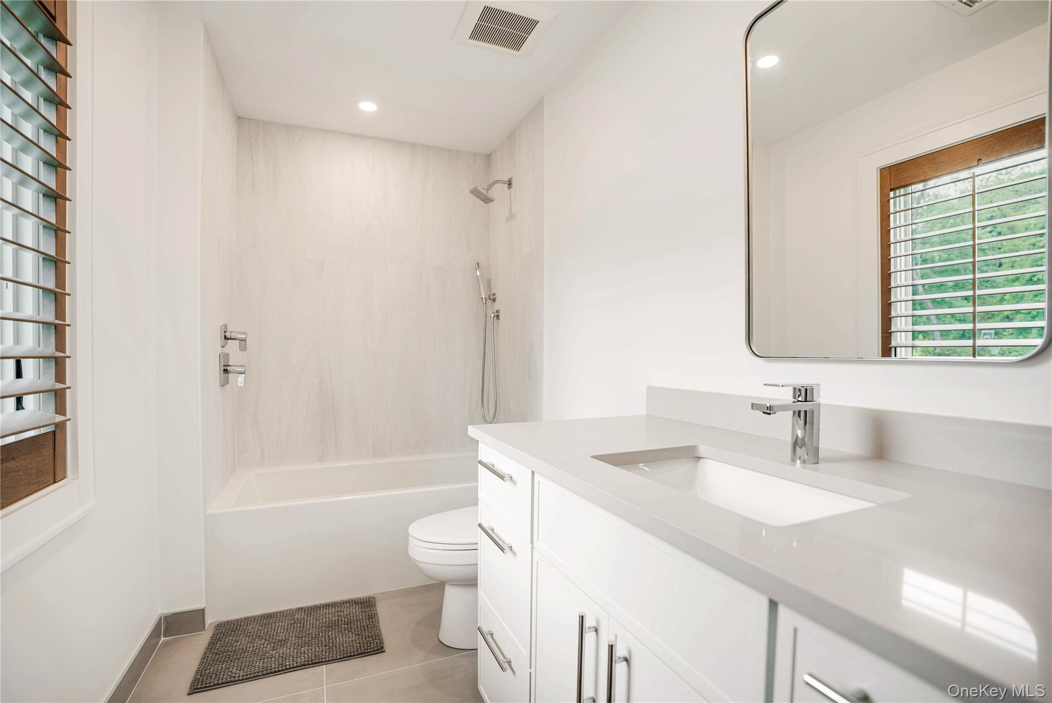 100 South Ferry Road Shelter Island, NY 11964 - Photo 20 of 28 a bathroom with a sink a toilet a tub and a mirror