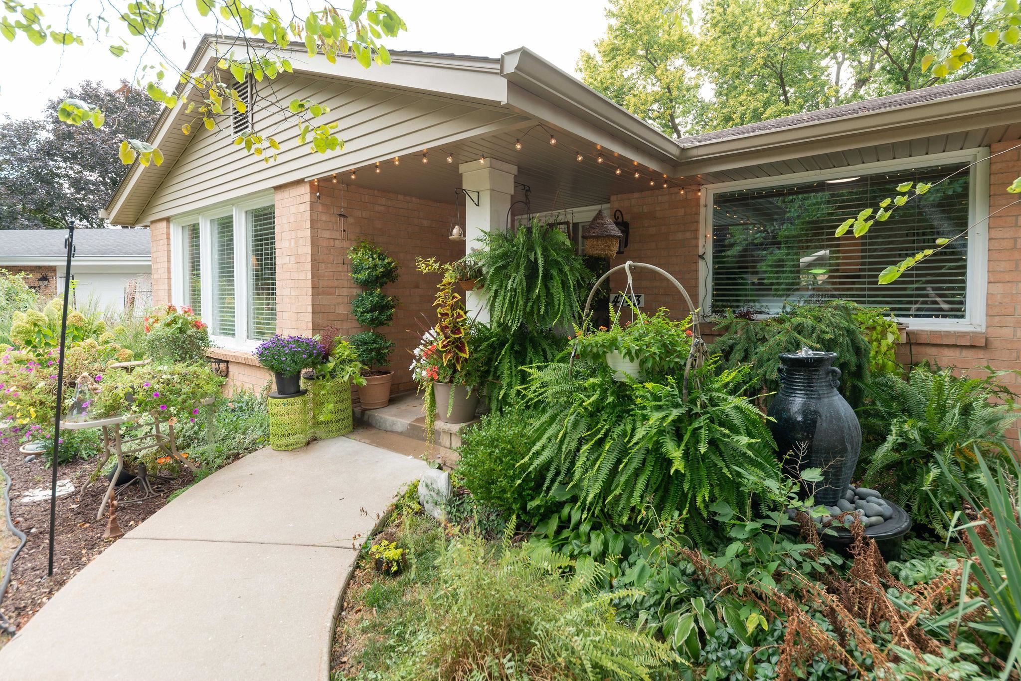 4743 Welsh Road Rockford, IL 61107 - Photo 11 of 52 a front view of a house with garden