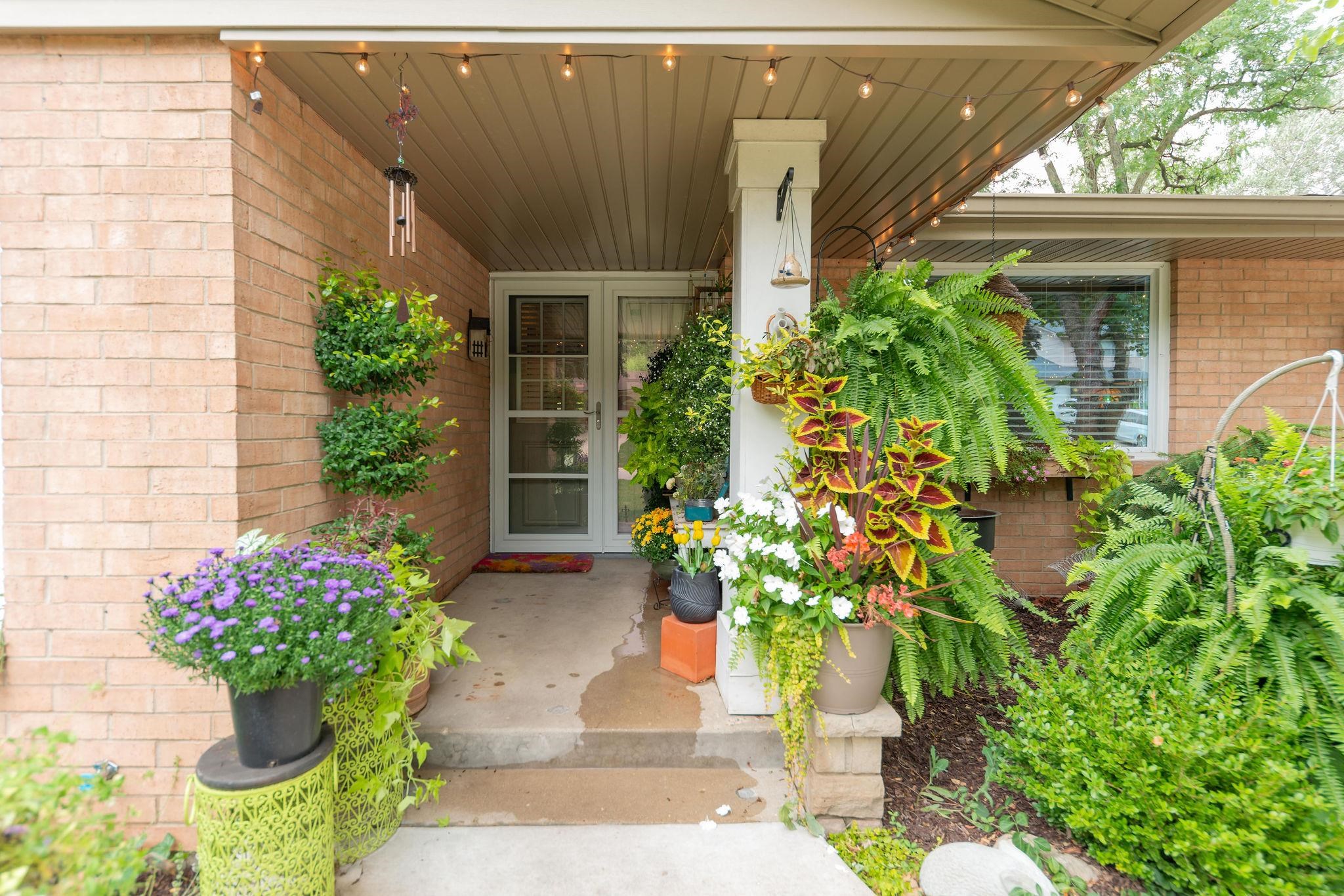 4743 Welsh Road Rockford, IL 61107 - Photo 12 of 52 a vase with flowers sitting on a brick wall