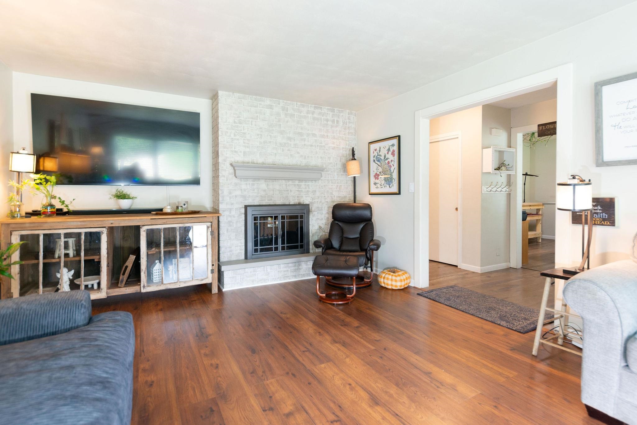 4743 Welsh Road Rockford, IL 61107 - Photo 15 of 52 a living room with furniture and a flat screen tv