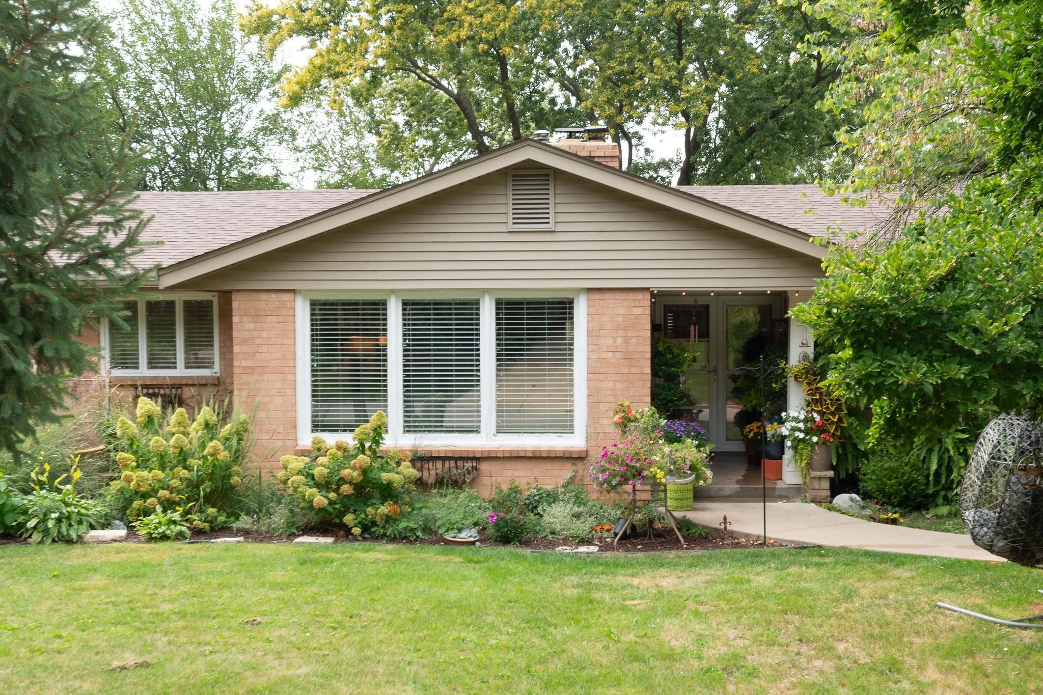 4743 Welsh Road Rockford, IL 61107 - Photo 2 of 52 a front view of a house with a yard and porch