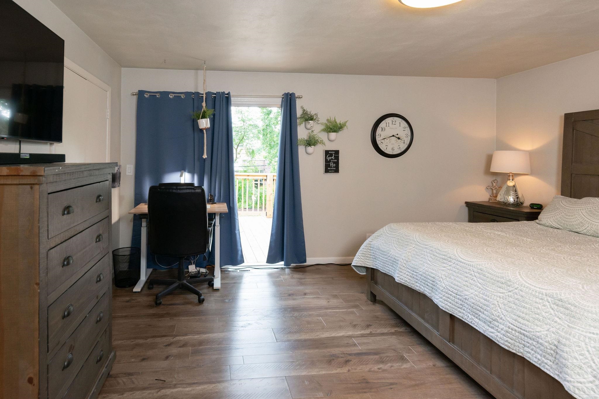 4743 Welsh Road Rockford, IL 61107 - Photo 26 of 52 a bedroom with a bed and a flat screen tv