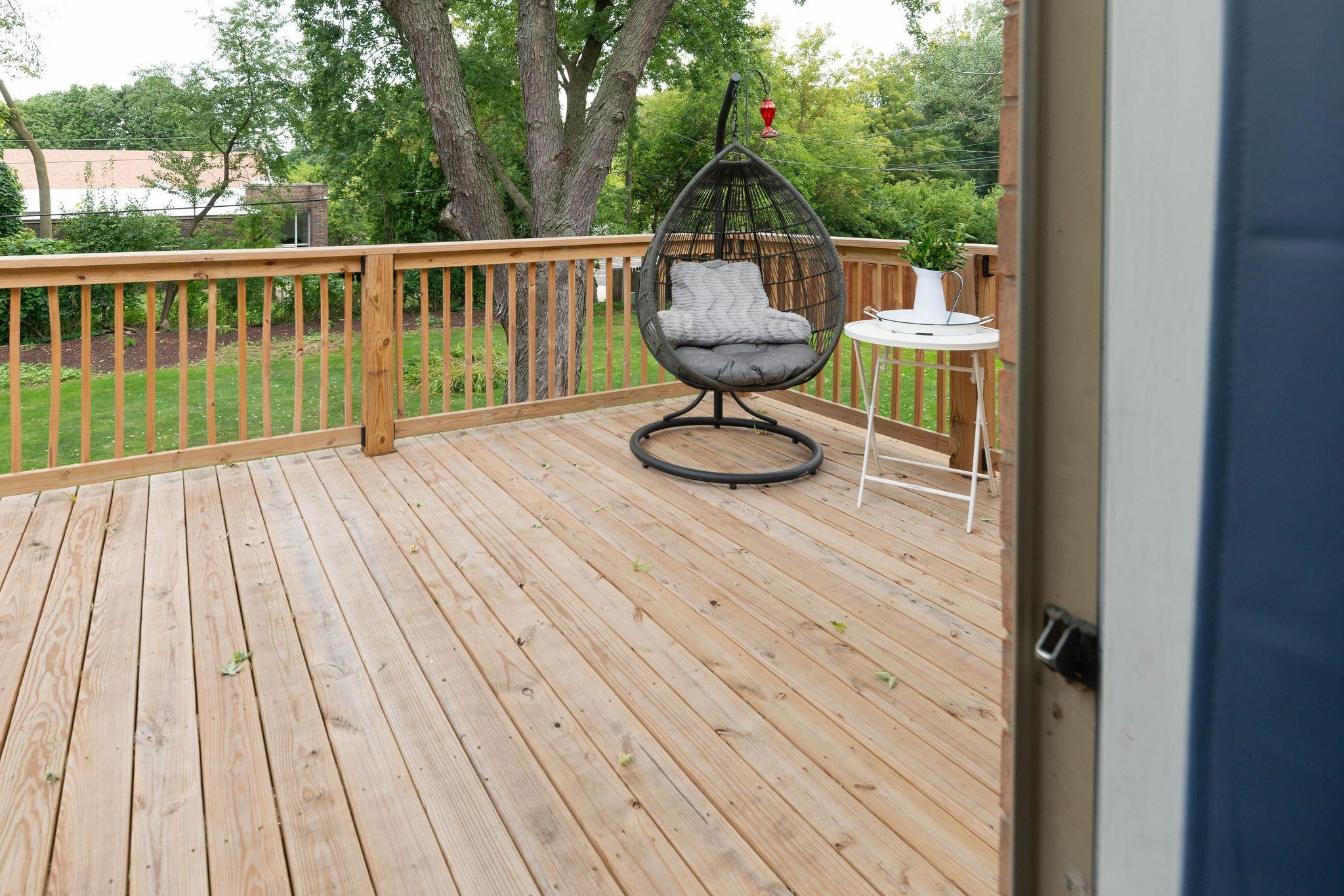 4743 Welsh Road Rockford, IL 61107 - Photo 27 of 52 a view of balcony with wooden floor and outdoor seating