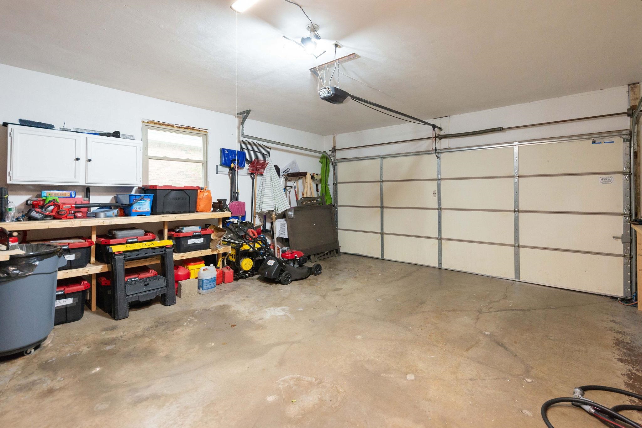 4743 Welsh Road Rockford, IL 61107 - Photo 36 of 52 a view of a garage with toys and a chandelier