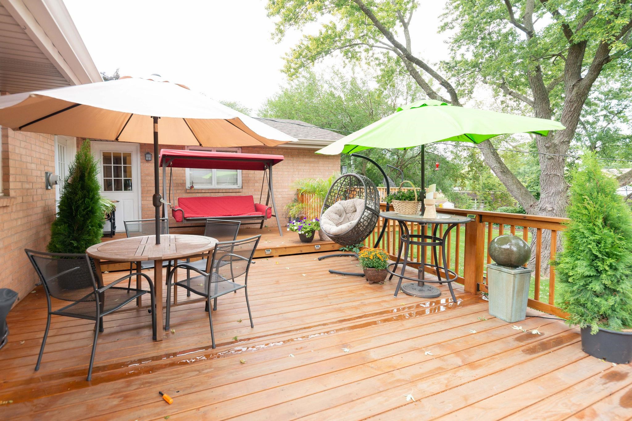 4743 Welsh Road Rockford, IL 61107 - Photo 38 of 52 a view of a patio with a table and chairs under an umbrella