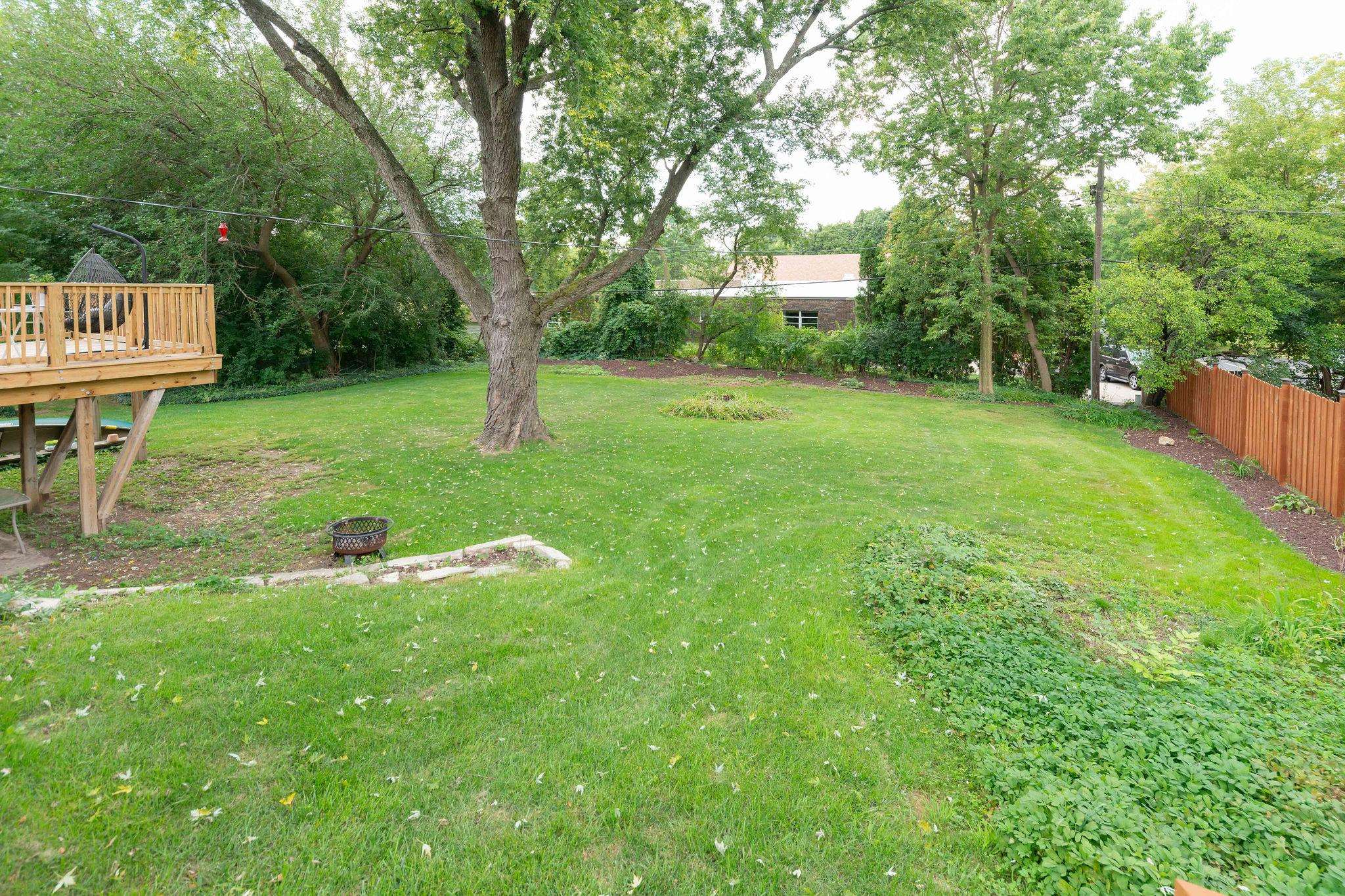 4743 Welsh Road Rockford, IL 61107 - Photo 41 of 52 a backyard of a house with seating and garden