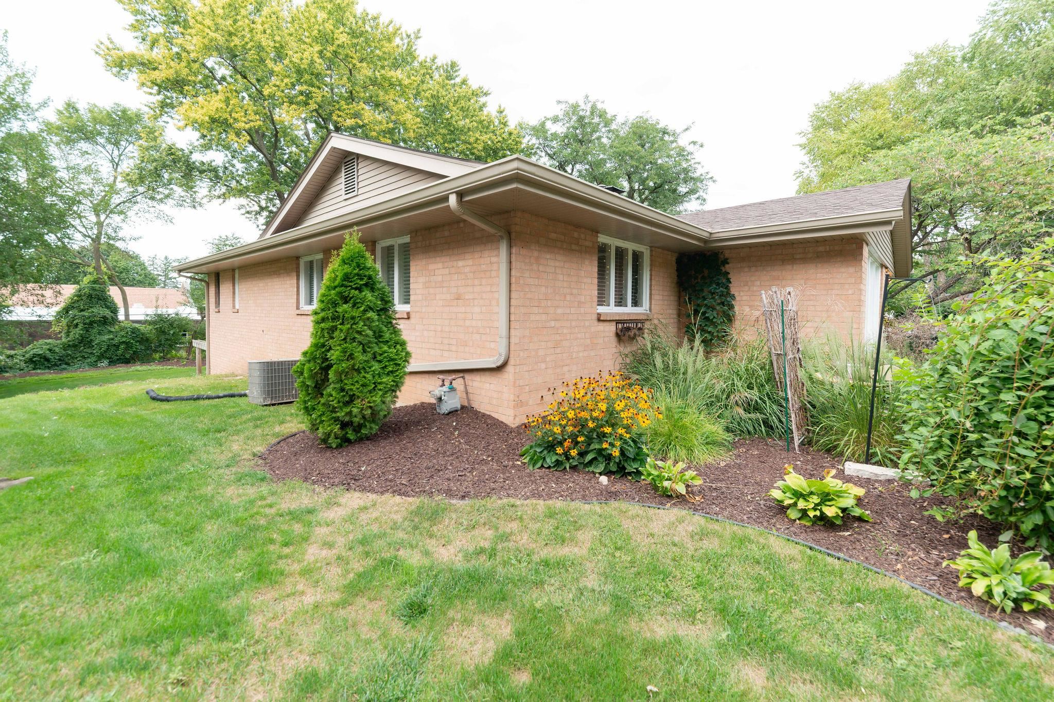 4743 Welsh Road Rockford, IL 61107 - Photo 44 of 52 a front view of house with yard and trees