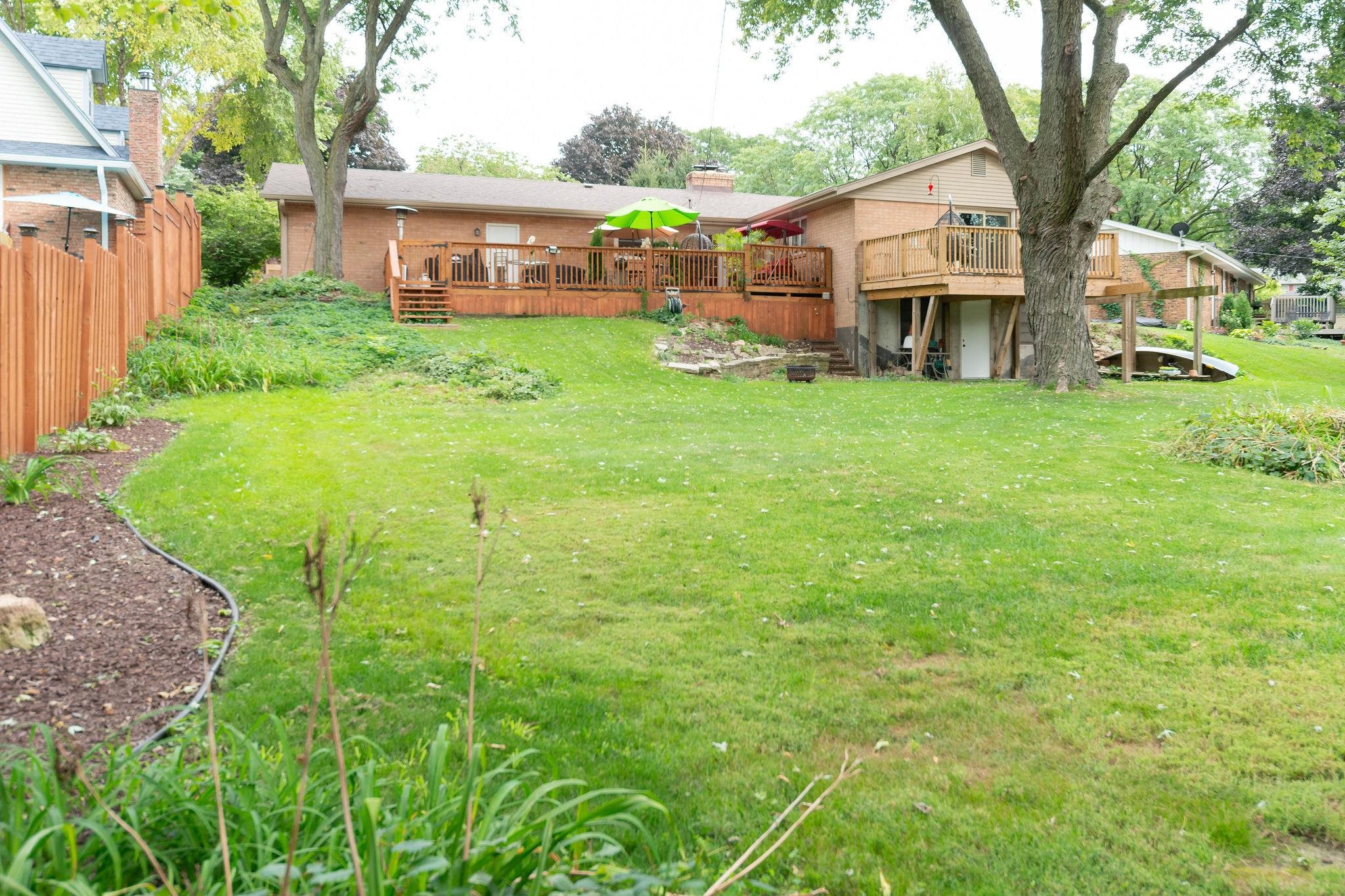 4743 Welsh Road Rockford, IL 61107 - Photo 48 of 52 a view of a house with a big yard and large trees