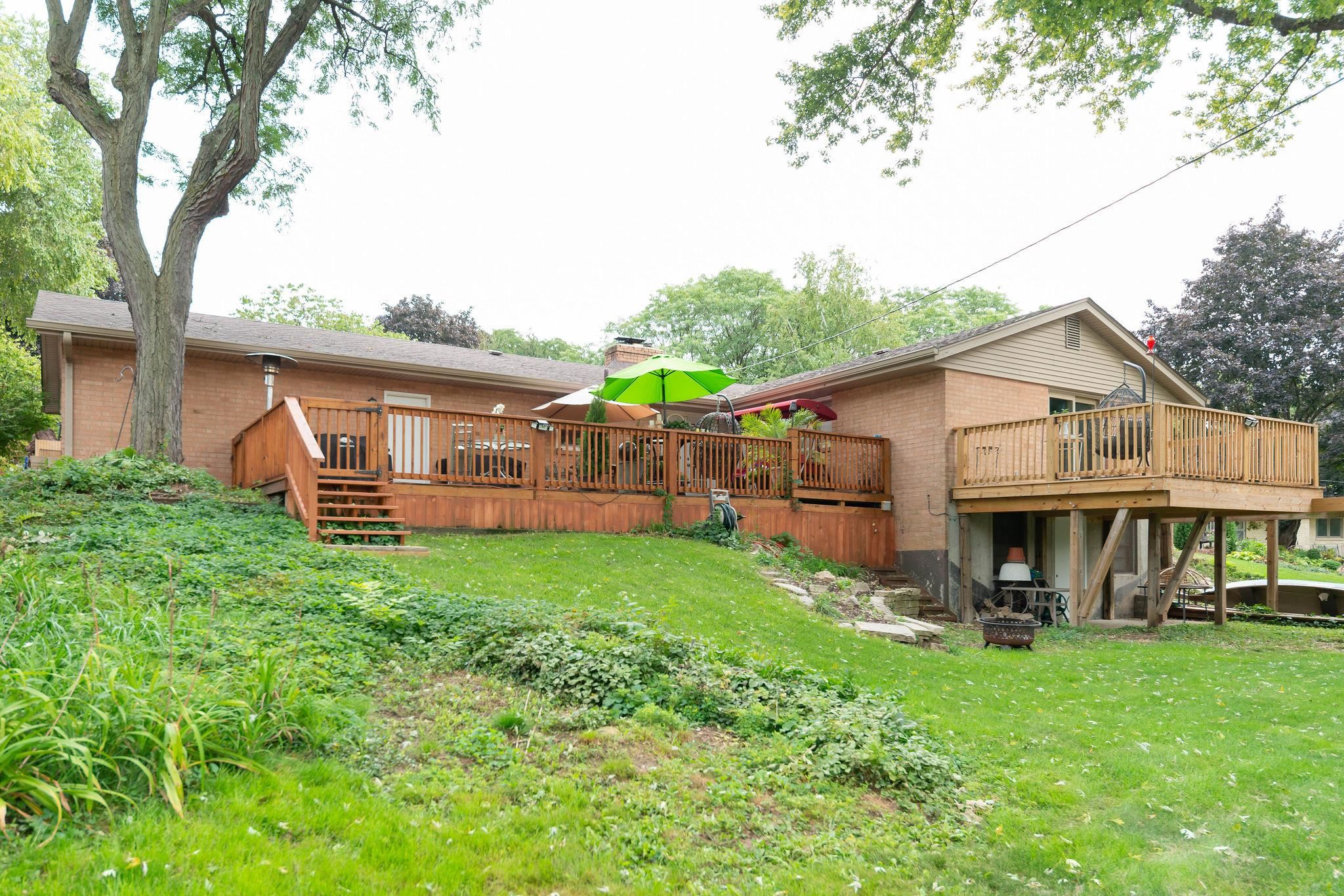 4743 Welsh Road Rockford, IL 61107 - Photo 49 of 52 a view of a house with a yard and lawn chairs