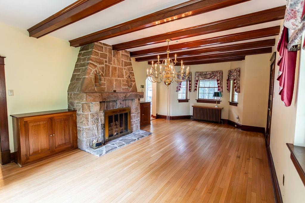 2541 Springfield Pike Connellsville, PA 15425 - Photo 26 of 49 a view of empty room with wooden floor and fireplace
