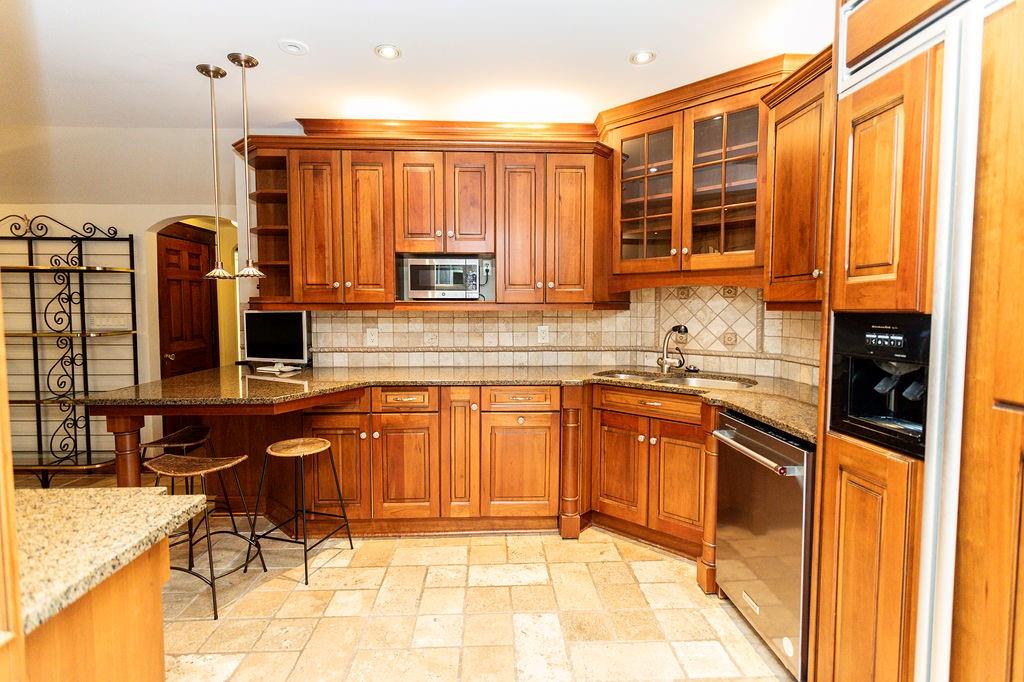 2541 Springfield Pike Connellsville, PA 15425 - Photo 30 of 49 a kitchen with stainless steel appliances granite countertop a stove a sink and a microwave