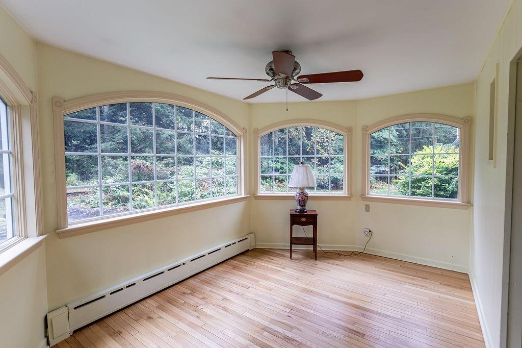 2541 Springfield Pike Connellsville, PA 15425 - Photo 32 of 49 an empty room with wooden floor and windows