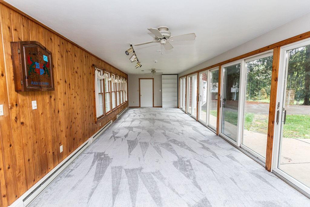 2541 Springfield Pike Connellsville, PA 15425 - Photo 34 of 49 a view of a hallway with wooden floor and windows