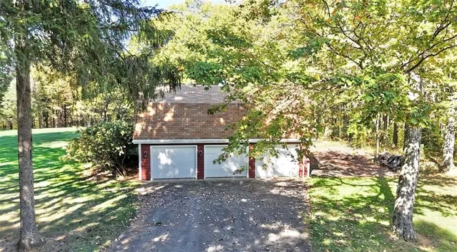 a view of a house with a tree