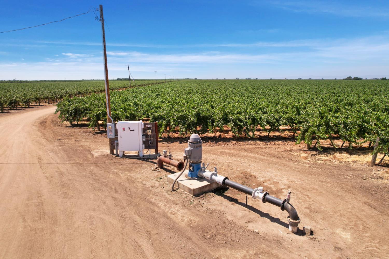 18190 Copperopolis Road Stockton, CA 95215 - Photo 15 of 35 a view of a swimming pool with a lounge chairs