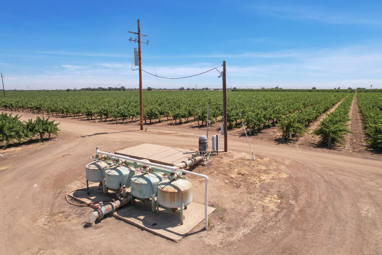 18190 Copperopolis Road Stockton, CA 95215 - Photo 9 of 35 a wooden bench sitting in the middle of a park