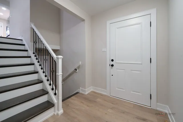 a view of entryway with wooden floor