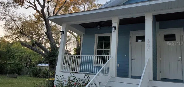 a large kitchen with stainless steel appliances kitchen island a large counter space a sink and a refrigerator