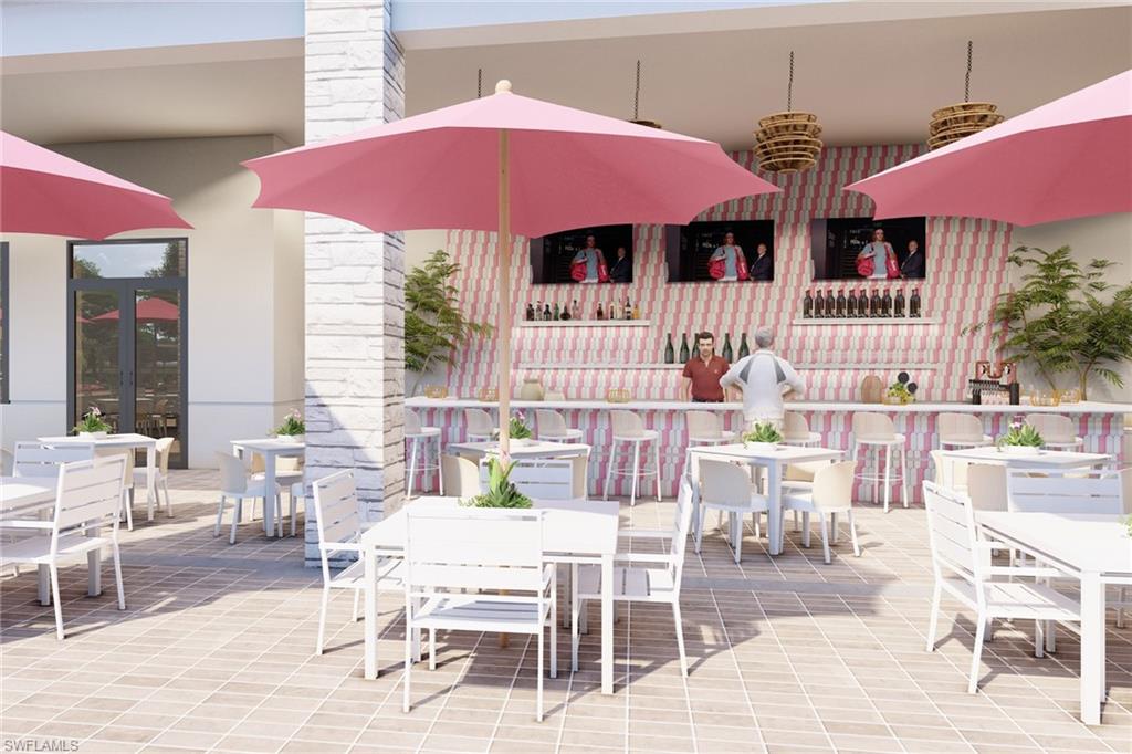2864 Bloomfield Way Naples, FL 34112 - Photo 39 of 40 a patio with a table and chairs under an umbrella