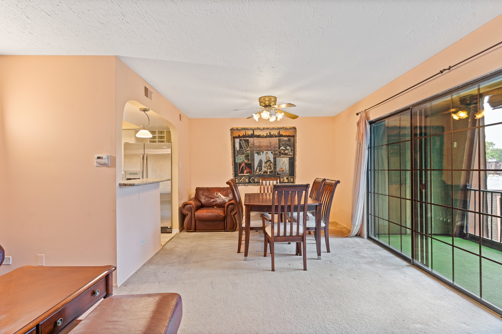 11130 NW Road, Unit E Palos Hills, IL 60465 - Photo 9 of 26 a dining room with furniture and a floor to ceiling window