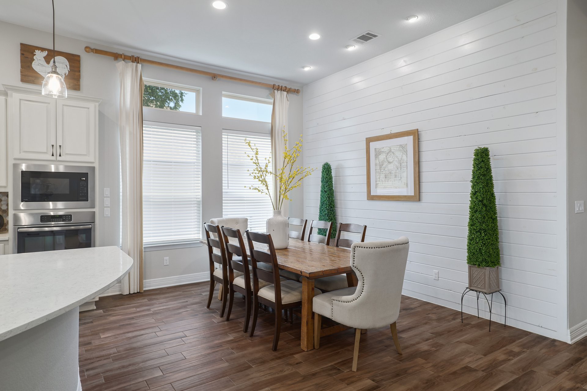 309 Rancho Sienna Loop Georgetown, TX 78628 - Photo 19 of 40 Dining area featuring a shiplap accent wall, wood-finish flooring, and recessed lighting