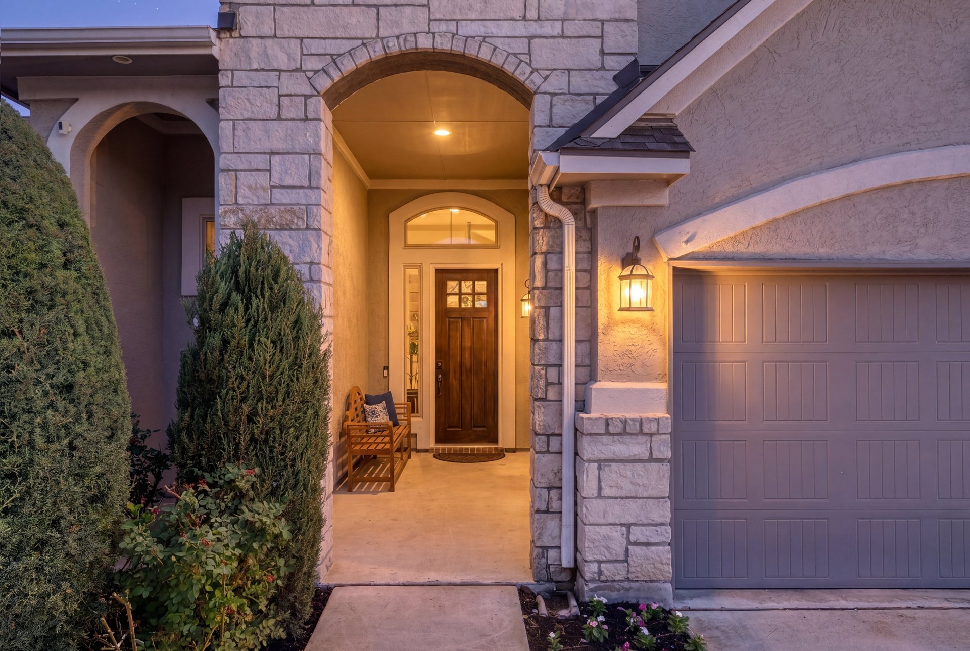 309 Rancho Sienna Loop Georgetown, TX 78628 - Photo 2 of 40 Arched entryway with stone facade