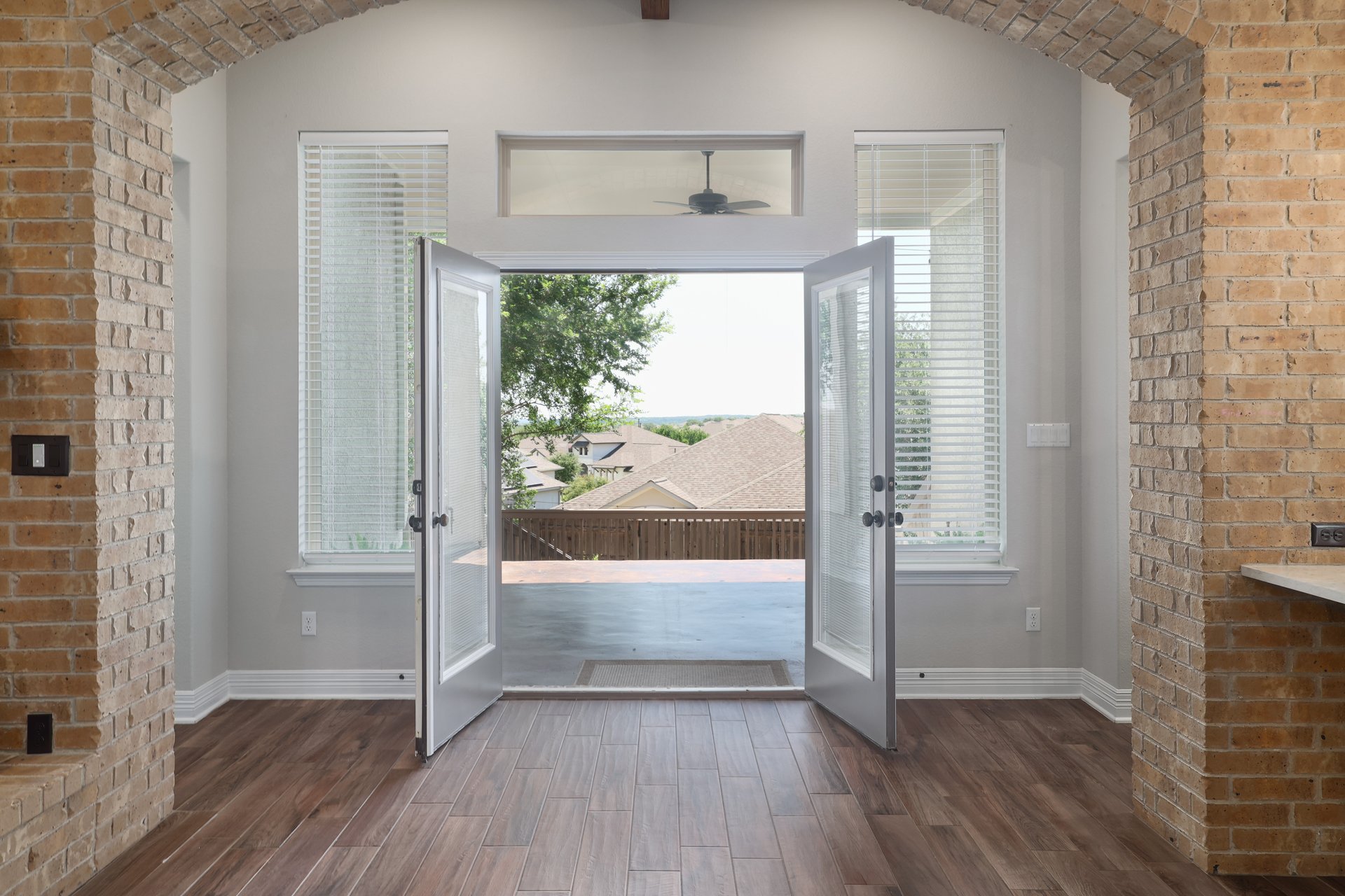 309 Rancho Sienna Loop Georgetown, TX 78628 - Photo 32 of 40 Double French doors open onto an exterior patio area