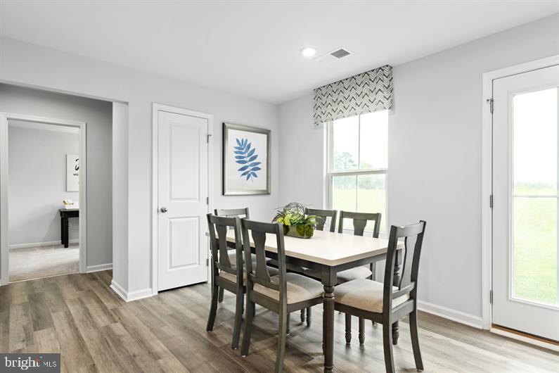4704 Cooks Point Court, Unit 5 Lanham, MD 20706 - Photo 5 of 17 a view of a dining room with furniture and window