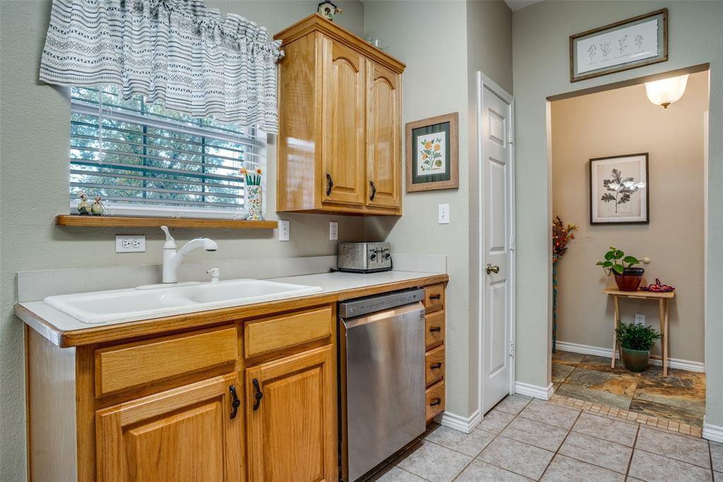 144 Red Road Howe, TX 75459 - Photo 12 of 27 a kitchen with a sink cabinets and window