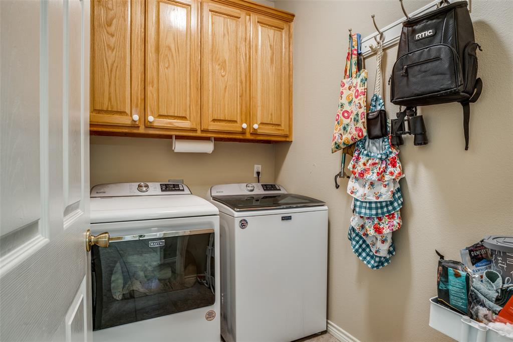 144 Red Road Howe, TX 75459 - Photo 15 of 27 a utility room with dryer and washer