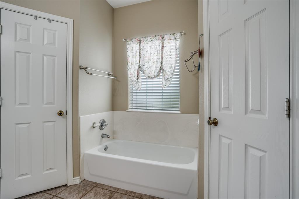 144 Red Road Howe, TX 75459 - Photo 26 of 27 a bathroom with bathtub and a shower
