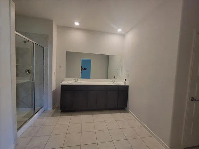 a bathroom with a sink a mirror and a bathtub